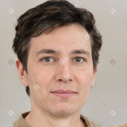 Joyful white adult male with short  brown hair and grey eyes