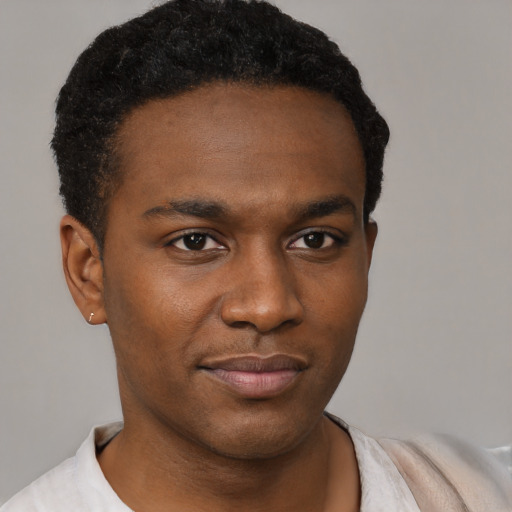 Neutral black young-adult male with short  brown hair and brown eyes