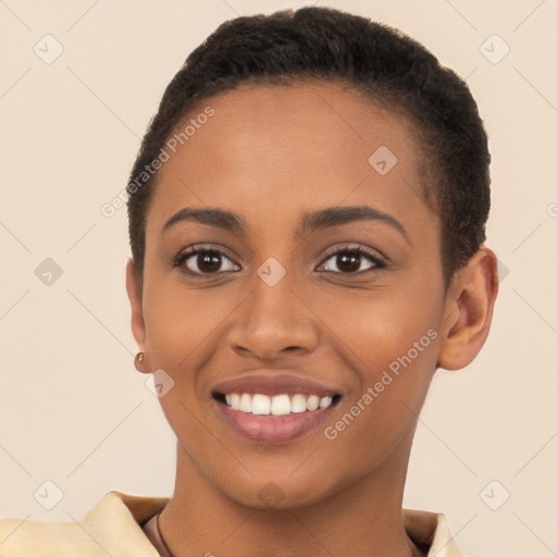 Joyful black young-adult female with short  brown hair and brown eyes