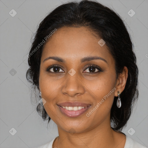 Joyful black young-adult female with medium  brown hair and brown eyes