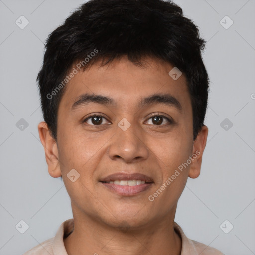 Joyful asian young-adult male with short  brown hair and brown eyes