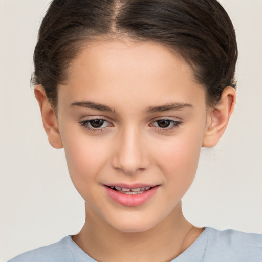 Joyful white child female with short  brown hair and brown eyes