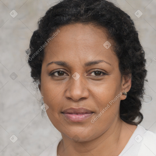 Joyful black adult female with medium  brown hair and brown eyes