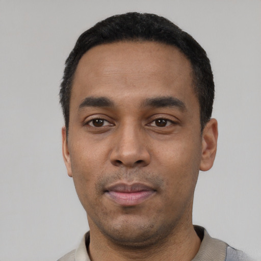 Neutral latino young-adult male with short  black hair and brown eyes