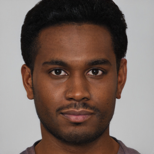 Neutral black young-adult male with short  brown hair and brown eyes