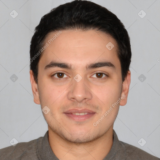 Joyful white young-adult male with short  black hair and brown eyes