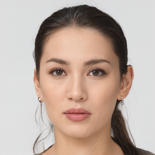 Neutral white young-adult female with long  brown hair and brown eyes