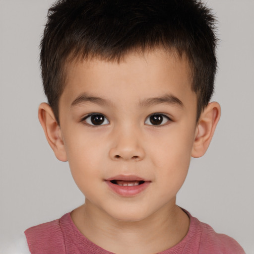 Joyful white child male with short  brown hair and brown eyes