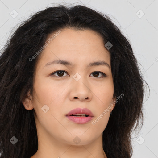 Joyful asian young-adult female with long  brown hair and brown eyes