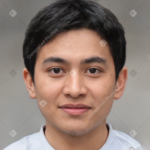 Joyful white young-adult male with short  black hair and brown eyes