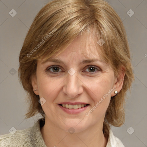 Joyful white adult female with medium  brown hair and blue eyes