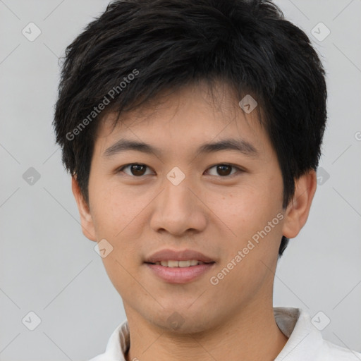 Joyful asian young-adult male with short  brown hair and brown eyes