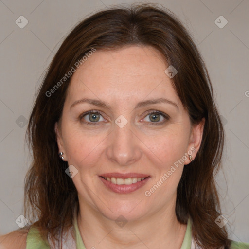 Joyful white adult female with medium  brown hair and grey eyes