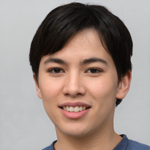 Joyful asian young-adult male with short  brown hair and brown eyes