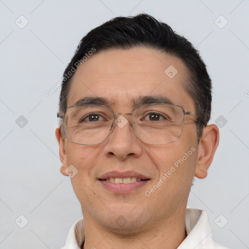 Joyful white adult male with short  brown hair and brown eyes