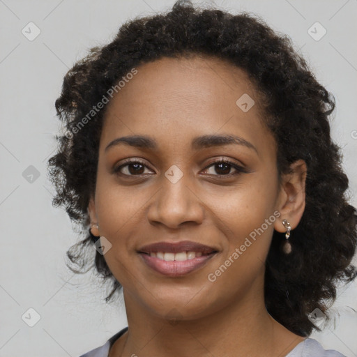 Joyful black young-adult female with medium  black hair and brown eyes