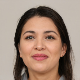 Joyful white adult female with medium  brown hair and brown eyes