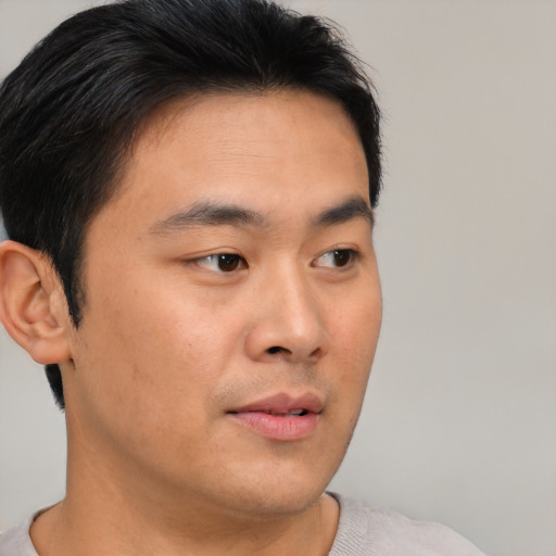 Neutral asian young-adult male with short  brown hair and brown eyes
