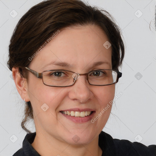 Joyful white adult female with medium  brown hair and grey eyes