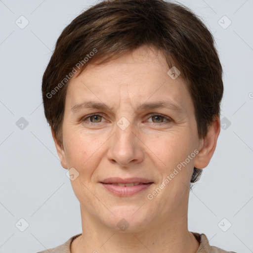 Joyful white adult female with short  brown hair and grey eyes