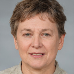 Joyful white adult male with short  brown hair and grey eyes