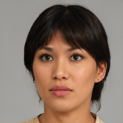 Neutral asian young-adult female with medium  brown hair and brown eyes