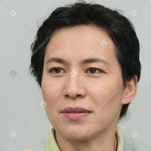 Joyful white adult female with short  brown hair and brown eyes