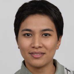 Joyful asian young-adult female with short  black hair and brown eyes