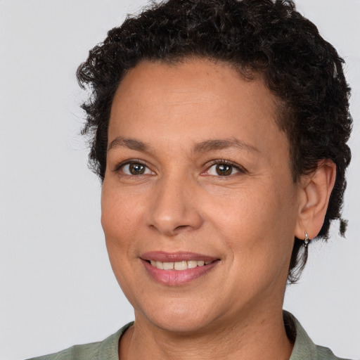 Joyful white adult female with short  brown hair and brown eyes