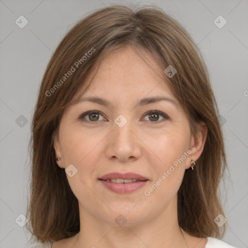 Joyful white adult female with medium  brown hair and brown eyes