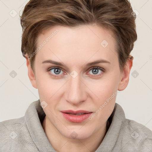 Joyful white young-adult female with short  brown hair and grey eyes