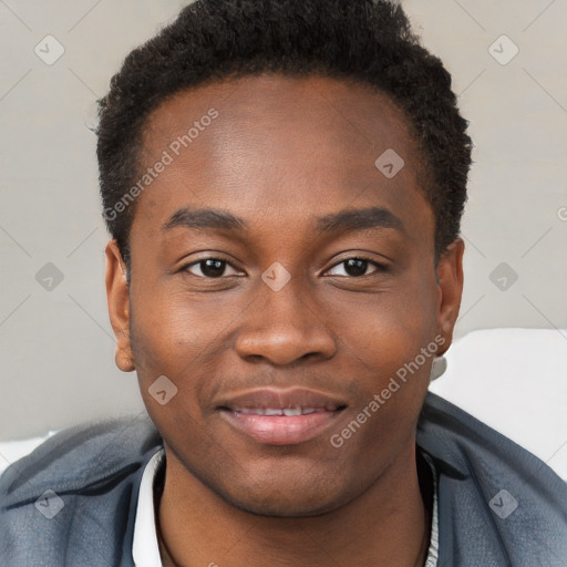 Joyful black young-adult male with short  brown hair and brown eyes