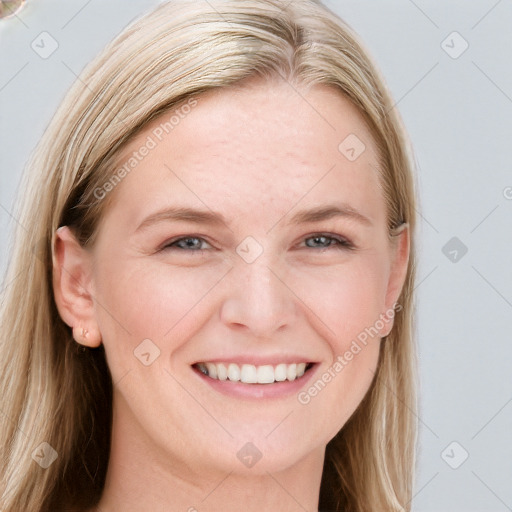 Joyful white young-adult female with long  brown hair and blue eyes