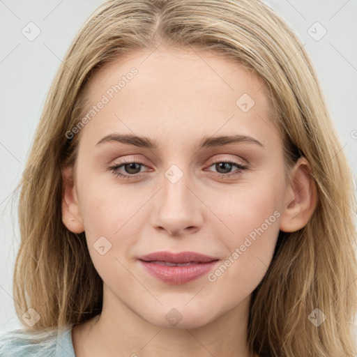 Joyful white young-adult female with long  brown hair and blue eyes