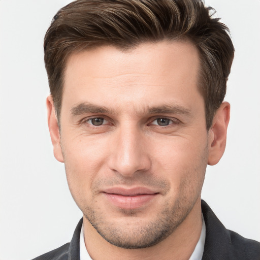 Joyful white young-adult male with short  brown hair and brown eyes