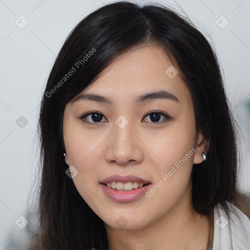 Joyful asian young-adult female with long  brown hair and brown eyes