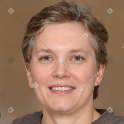 Joyful white adult female with short  brown hair and grey eyes