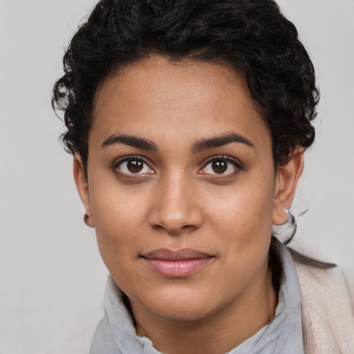 Joyful latino young-adult female with short  brown hair and brown eyes