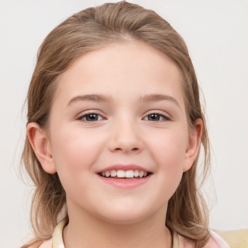 Joyful white child female with medium  brown hair and grey eyes