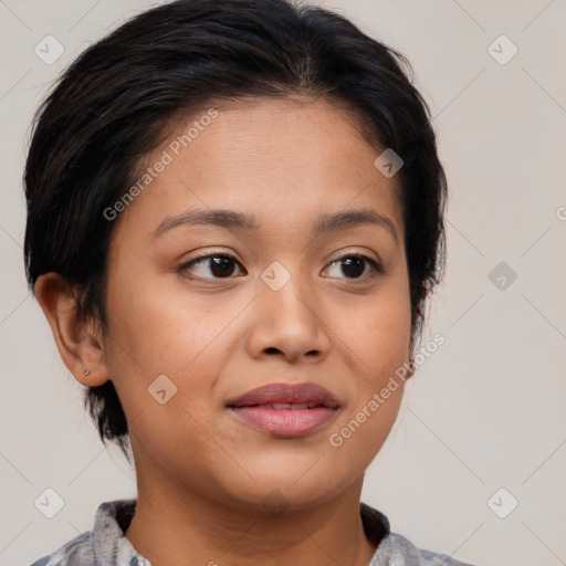 Joyful latino young-adult female with medium  brown hair and brown eyes