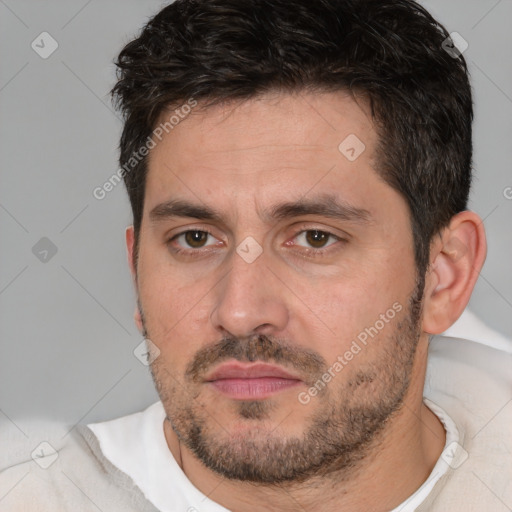 Joyful white adult male with short  brown hair and brown eyes