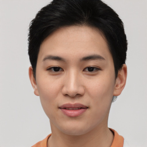 Joyful asian young-adult female with short  black hair and brown eyes
