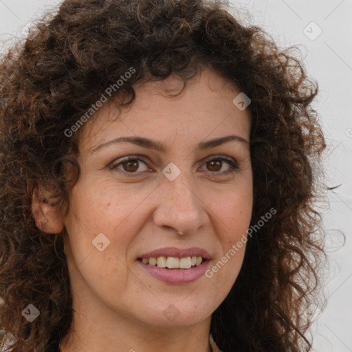 Joyful white adult female with long  brown hair and brown eyes