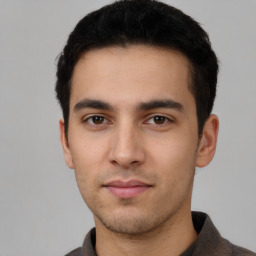 Neutral white young-adult male with short  black hair and brown eyes
