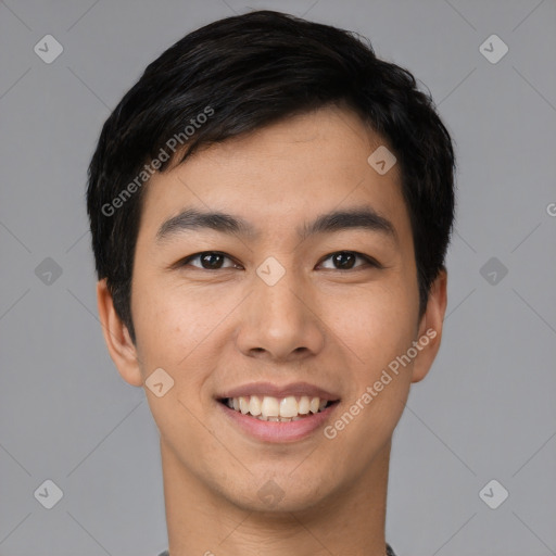 Joyful asian young-adult male with short  black hair and brown eyes