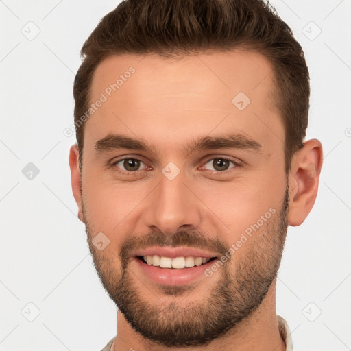 Joyful white young-adult male with short  brown hair and brown eyes