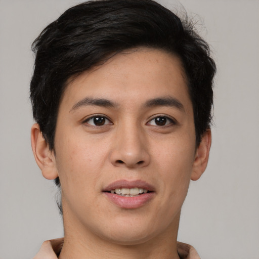 Joyful asian young-adult male with short  brown hair and brown eyes