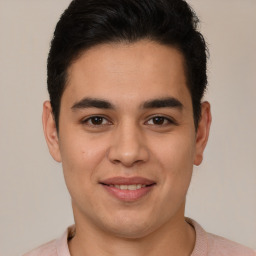 Joyful latino young-adult male with short  brown hair and brown eyes