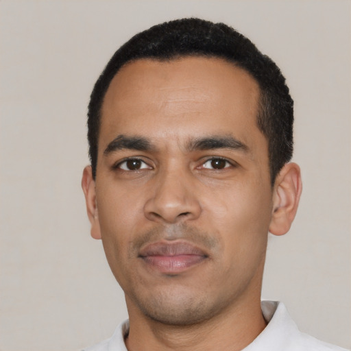Neutral latino young-adult male with short  black hair and brown eyes