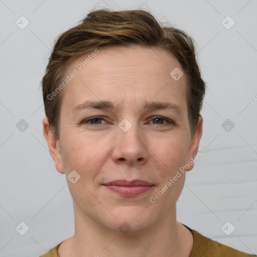 Joyful white adult female with short  brown hair and grey eyes